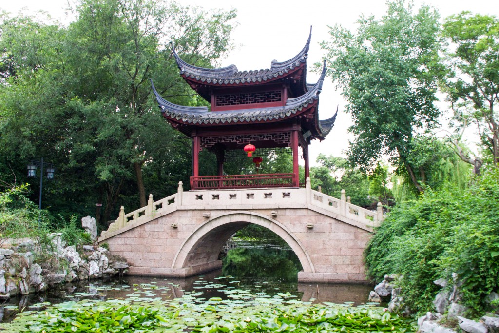 #369. Garden bridge over pond in China.